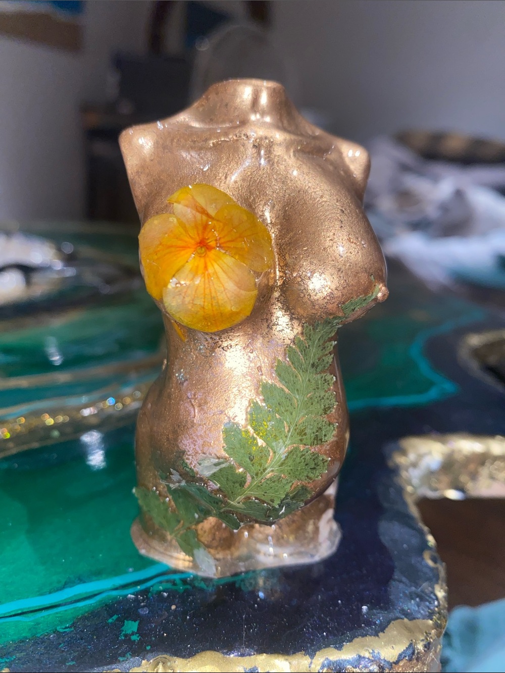 Pregnant Female Torso Sculpture with Floral Accents